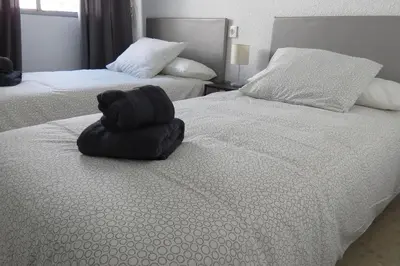 Cama o camas de una habitación en Patios de San Rafael