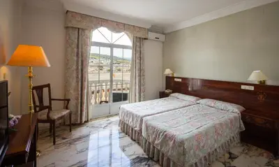Cama o camas de una habitación en Hotel Hidalgo