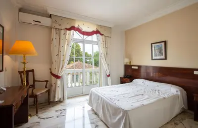 Cama o camas de una habitación en Hotel Hidalgo