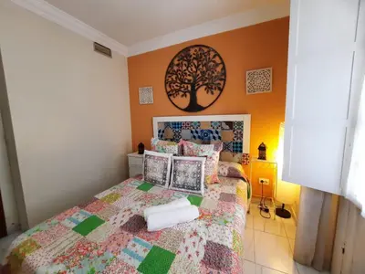 Cama o camas de una habitación en Budget and cute rooms with balcony Sevilla center