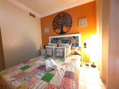 Cama o camas de una habitación en Budget and cute rooms with balcony Sevilla center