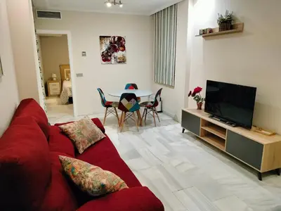 Una televisión o centro de entretenimiento en Acogedor apartamento. Mezquita Wifi
