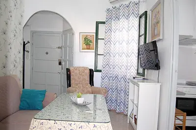 Una televisión o centro de entretenimiento en Apartamento San Juan de Dios