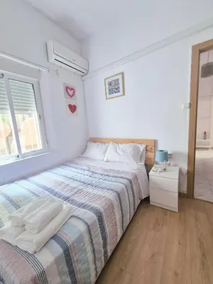 Cama o camas de una habitación en Enjoy Sevilla Familia