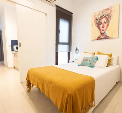 Cama o camas de una habitación en GoToSeville ALTAIR SUITES