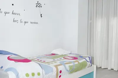 Cama o camas de una habitación en Charming city centre apartment in Córdoba with parking