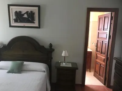 Cama o camas de una habitación en Paredejas del Rey