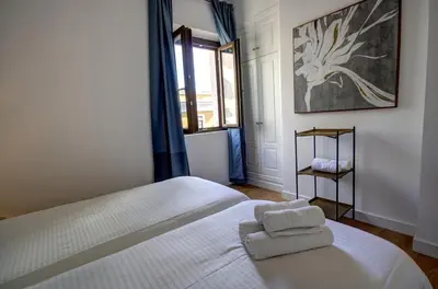 Cama o camas de una habitación en Apartamentos Setas Center