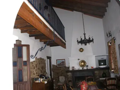 Una televisión o centro de entretenimiento en Vivienda Turística Alojamiento Rural EL Trillo