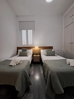 Cama o camas de una habitación en DreamsApt Curtidores 6 Suites AT