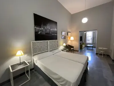 Cama o camas de una habitación en DreamsApt Curtidores 6 Suites AT