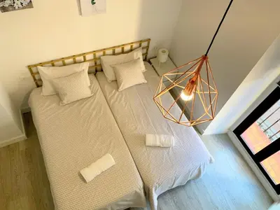 Cama o camas de una habitación en Casa Ribera LUCANO Centro Histórico