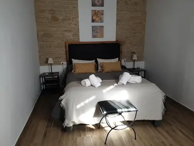 Cama o camas de una habitación en Entre patios y flores