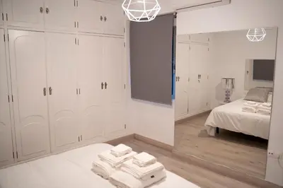 Cama o camas de una habitación en Apartamento turístico Calle San Basilio 6 patios