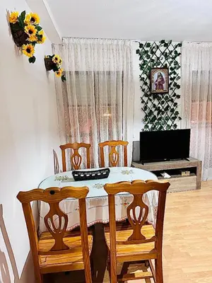 Una televisión o centro de entretenimiento en Apartamentos Ruz