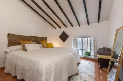 Cama o camas de una habitación en Casa Randonneur, traditional townhouse in Álora.