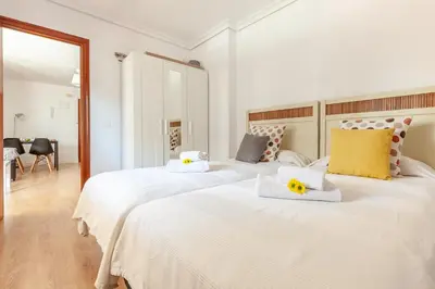 Cama o camas de una habitación en Apartamento luminoso y acogedor en Sevilla. A/C.