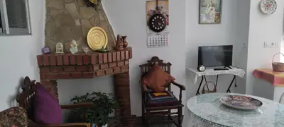 Una televisión o centro de entretenimiento en Casa Lola