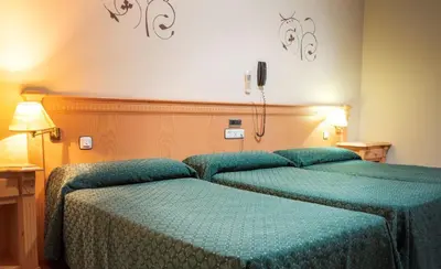 Cama o camas de una habitación en Hotel El Cruce Chauchina