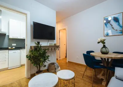 Una televisión o centro de entretenimiento en Feijóo Suite Apartment