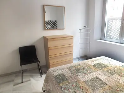 Cama o camas de una habitación en Las Setas Sevilla Alhondiga