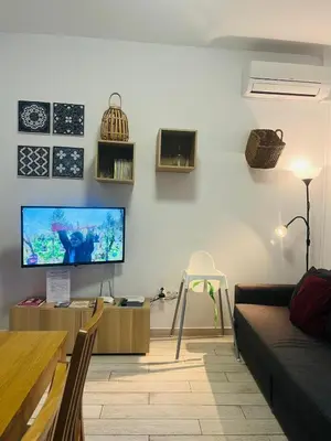 Una televisión o centro de entretenimiento en Casa Puerta de la Alcazaba Antequera