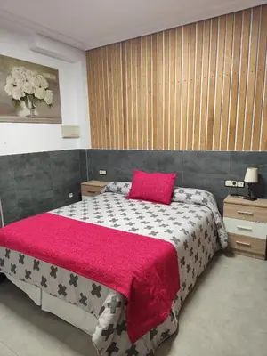 Cama o camas de una habitación en El LEGADO