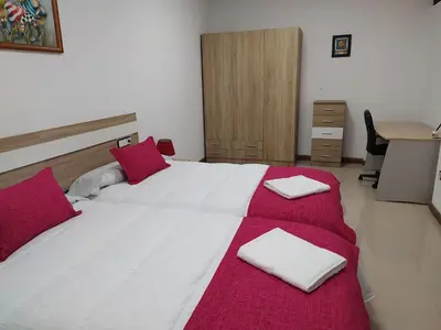 Cama o camas de una habitación en El LEGADO