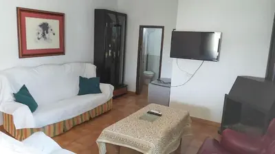 Una televisión o centro de entretenimiento en Casa Rural Los Caballos Finca Canca Alora Caminito del Rey