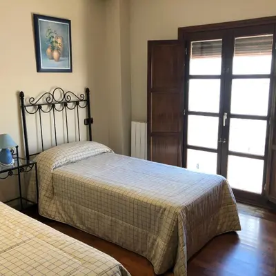 Cama o camas de una habitación en La casa de Tita Elvira 2