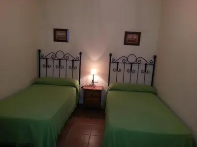 Cama o camas de una habitación en Pensión y apartamentos El Taxi