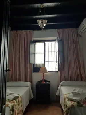Cama o camas de una habitación en Casa S. XIX en pleno centro de Carmona