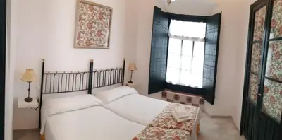 Cama o camas de una habitación en Casa S. XIX en pleno centro de Carmona