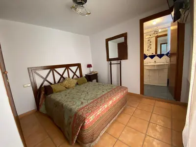Cama o camas de una habitación en APARTAMENTO RURAL CASA MONTE