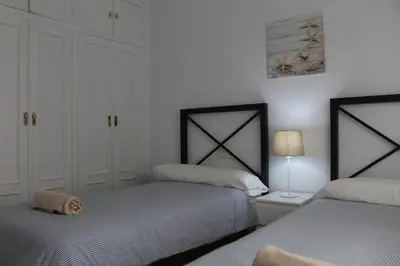Cama o camas de una habitación en PISO EN PLENO CORAZÓN DE CORDOBA