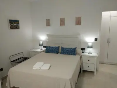 Cama o camas de una habitación en Apartamentos Cordoba
