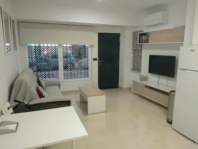 Una televisión o centro de entretenimiento en Apartamentos Cordoba