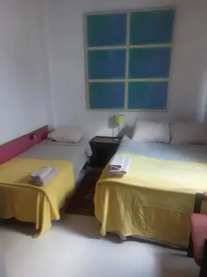 Cama o camas de una habitación en Alameda Hércules Apartamento