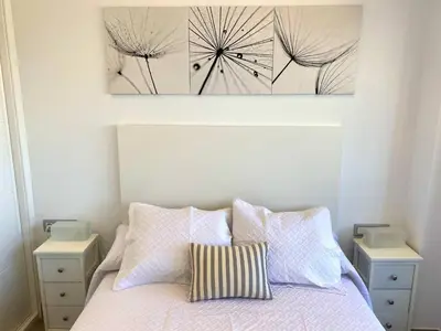 Cama o camas de una habitación en Residencial Santa Justa - Vacacional Sevilla