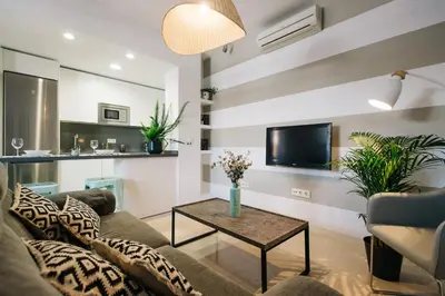 Una televisión o centro de entretenimiento en Encarnación Suite Apartment