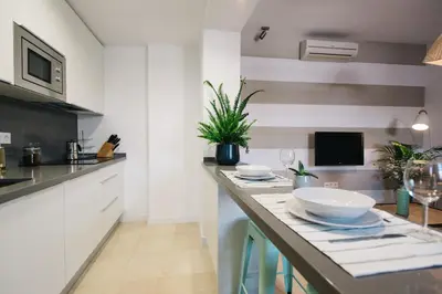 Una cocina o zona de cocina en Encarnación Suite Apartment