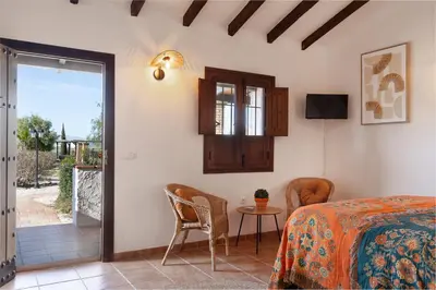 Cama o camas de una habitación en Boutique B&B Cortijo Valverde Álora