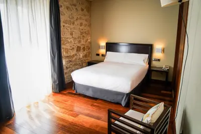 Cama o camas de una habitación en Hotel Baeza Monumental by eme hoteles