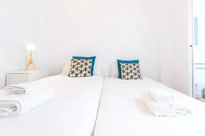 Cama o camas de una habitación en Alohamundi Alameda III