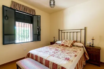 Cama o camas de una habitación en Cortijo El Carmen Finca El Revuelo
