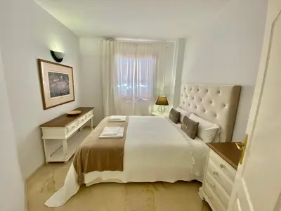 Cama o camas de una habitación en Portico Sevilla