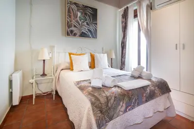 Cama o camas de una habitación en A 20 Metros De La MEZQUITA CATEDRAL ,APARTAMENTOS TURISTICO CESPEDES 5