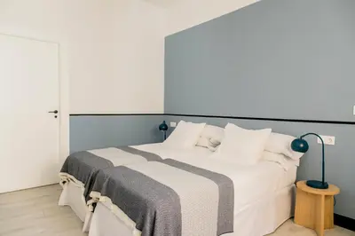 Cama o camas de una habitación en Pasaje Zamora Apartamentos