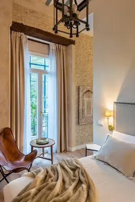 Cama o camas de una habitación en Casa Sevilla 1855 Suites by Época