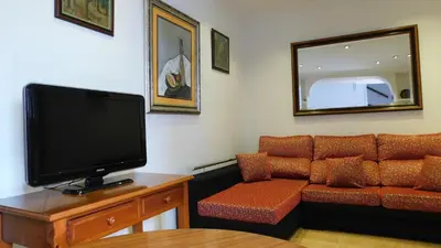 Una televisión o centro de entretenimiento en Casa de la Abuela Pepa